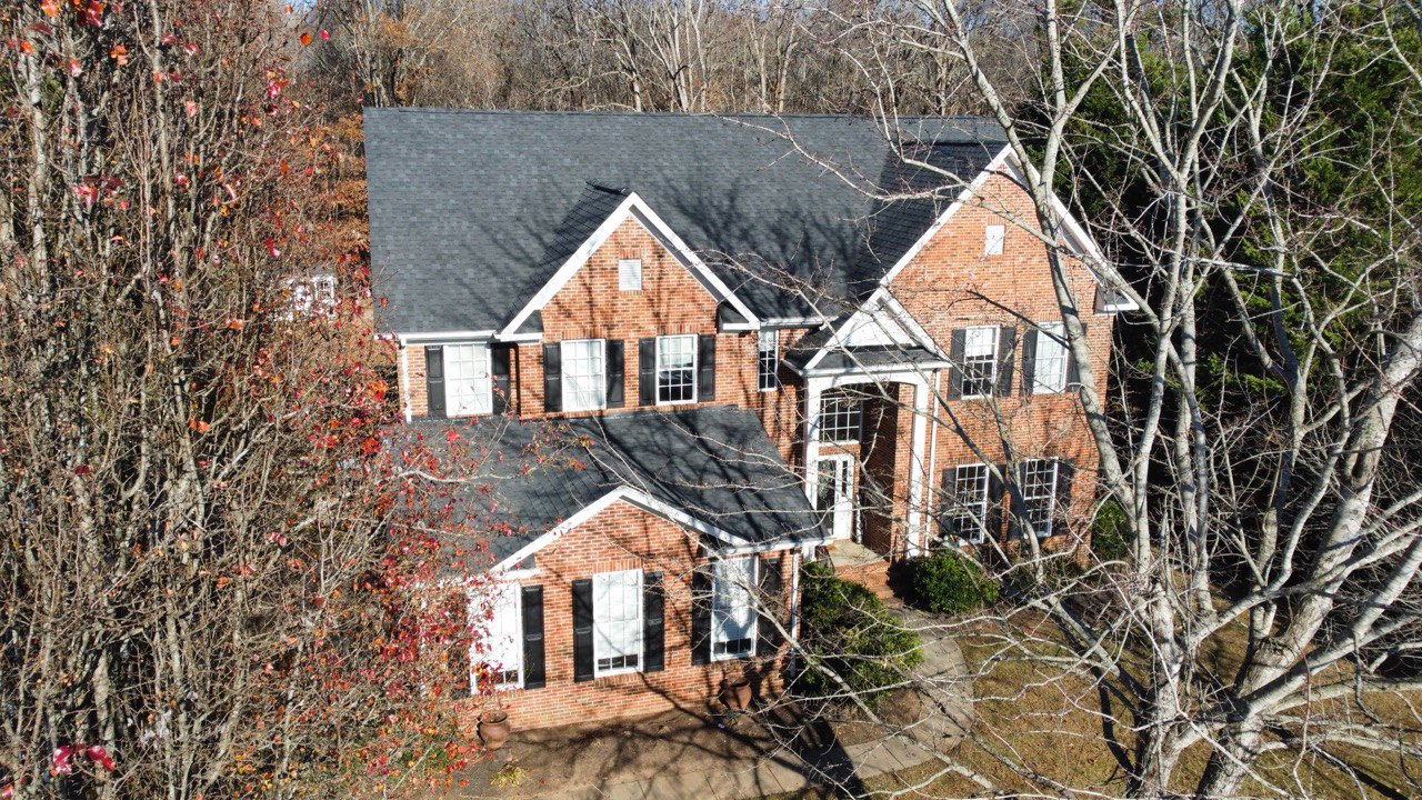 Elevated view of a Triumph Roofing project on a brick home in Huntersville, North Carolina